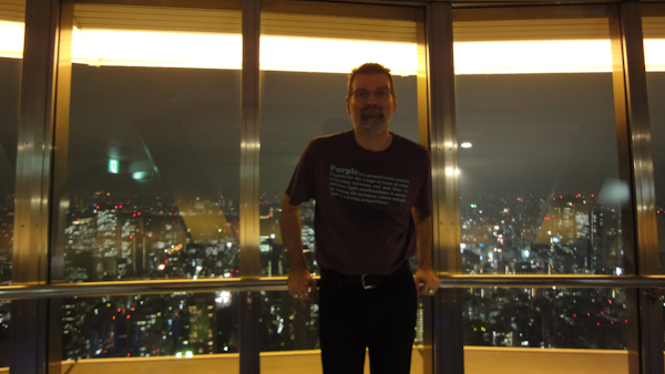 a selfie in front of the night view of tokyo